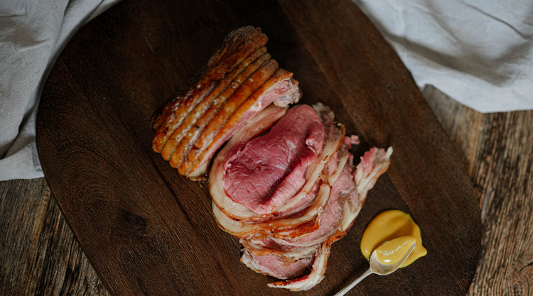 A picture of an outstanding grass fed beef sirloin roasting joint cooked to perfection from beacon farms. Beacon farms provides nationwide delivery of their very own grass fed beef. Reared following sustinable farm practices, this grass fed beef is heritage breed and dry aged by our master butchers to delivery the very best beef on the market. 